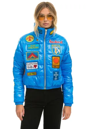 VINTAGE PATCH APRES PUFFER JACKET - BLUE CINA GLOSSY